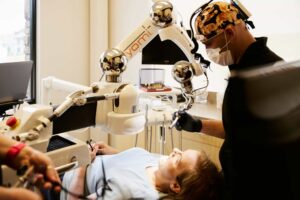 Dr. Bryce Richardson performing dental implant surgery with Yomi robotic system at Boulder dental office